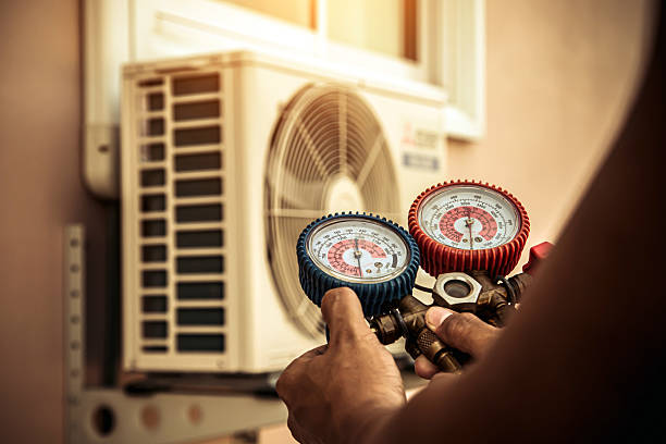 Professional Air Conditioning Service technician working in Morgantown, IN